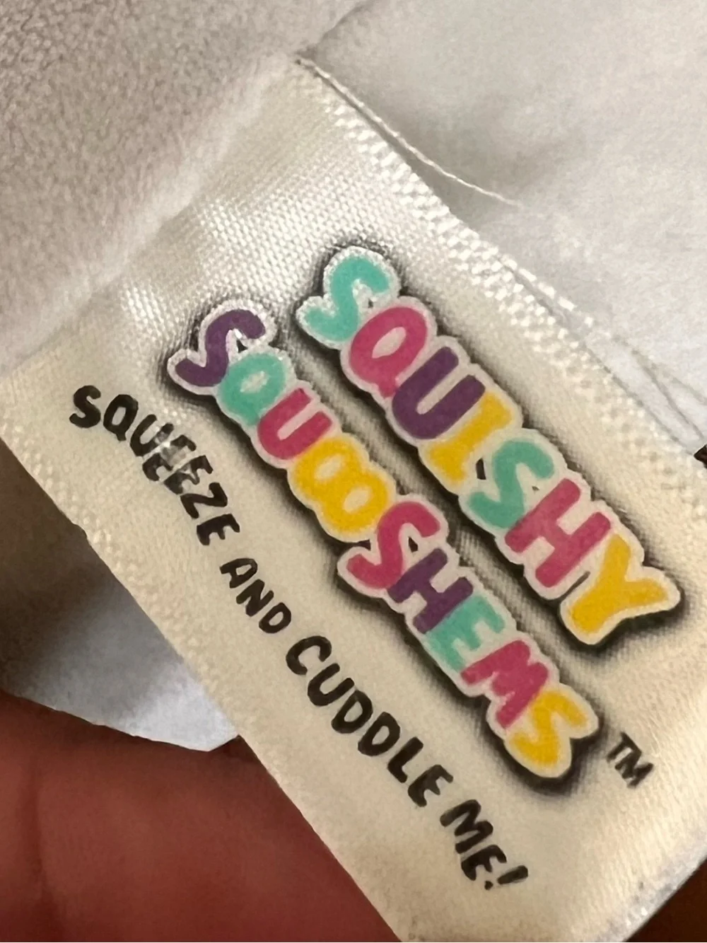Squishable cuddles embroidered stitching